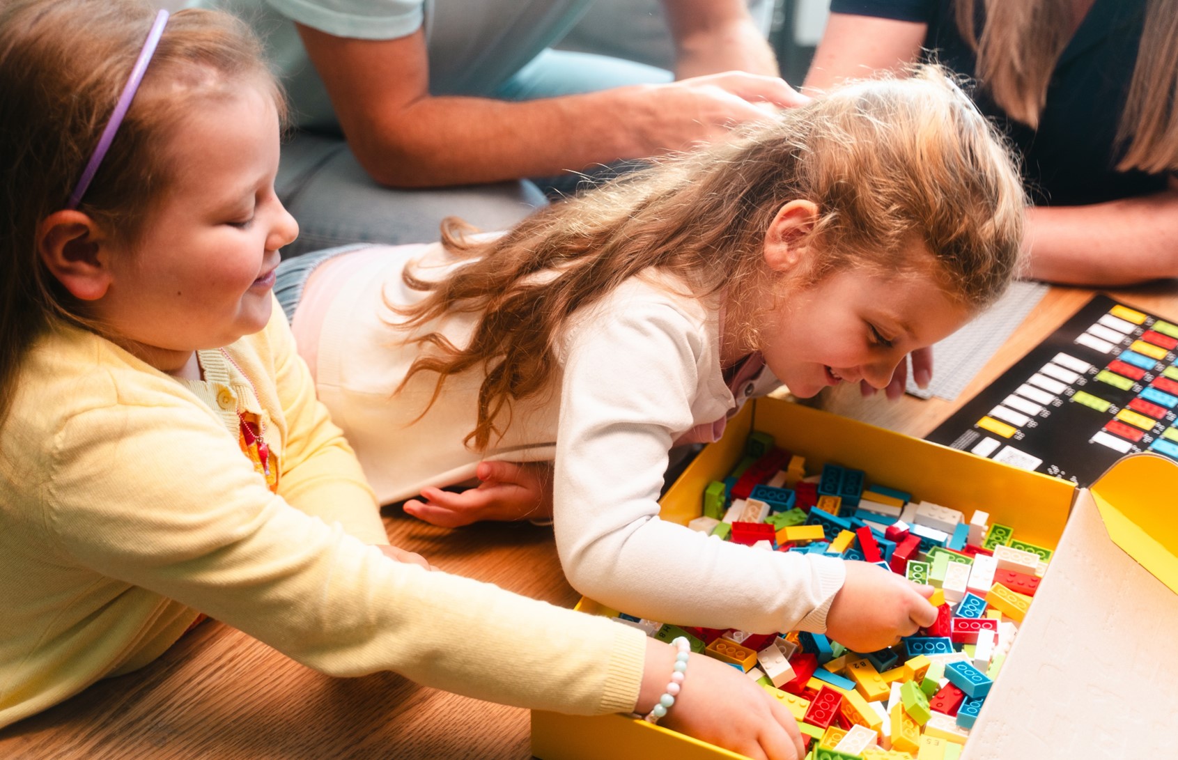 An image of children playing Lego braille blocks